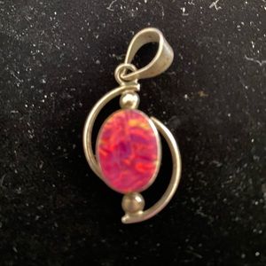 Pink stone pendant w/ silver from 950 sterling silver.